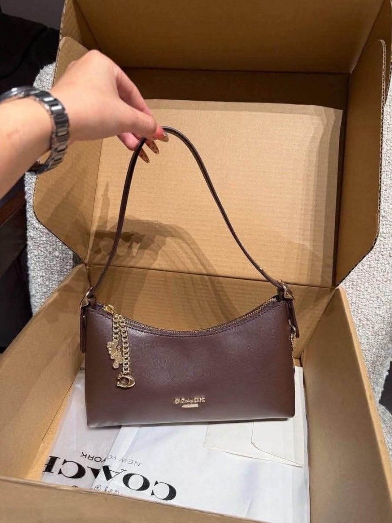 Coach Emeilia Shoulder Bag (Category: Shoulder Bags) located in Quezon City. Submitted by bagsboutiqueph (Listing ID 1463493625, Image 2). Description: LAST PRICE POSTED. LIMITED STOCKS! BRANDNEW WITH INCLUSIONS. COLOR MAY SLIGHTLY VARY IN ACTUAL DUE TO LIGHTING AND CAMERA SETTING. OTHER PHOTOS WILL BE SEND DURING PURCHASE AND FOR SURE BUYERS ONLY. WHEN IN DOUBT, DO NOT ORDER. THANK YOU..