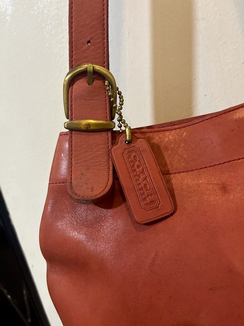 Coach Leather Shoulder Bag (Category: Luxury Bags & Wallets) located in Bacolod City. Submitted by vintage_vogue6100 (Listing ID 1463381088, Image 2). Description: - Classic Coach leather shoulder bag - Rich reddish-brown color - Adjustable buckle strap for customized fit - Authentic Coach hangtag included - Minor leather marks consistent with normal use - Plenty of life left, perfect for everyday carry.