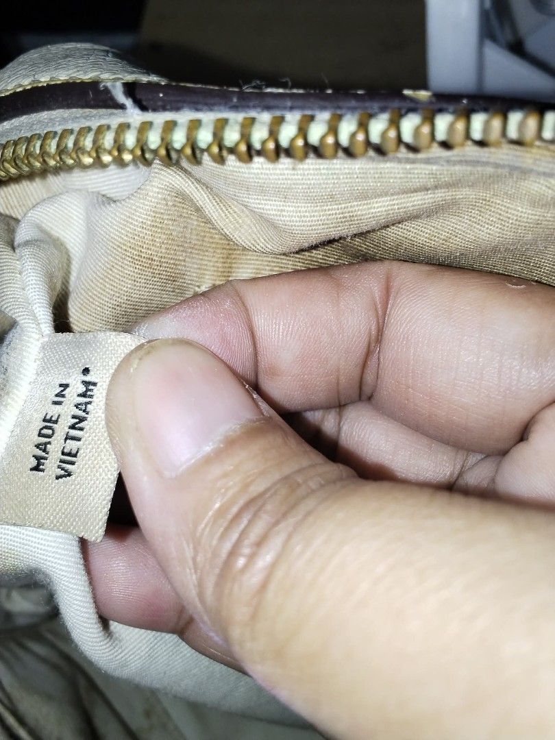 Coach Monogram Canvas Leather Trim Satchel Bag (Category: Cross-body Bags) located in Manila. Submitted by bagelyascollection (Listing ID 1463361719, Image 3). Description: - Authentic Coach satchel bag - Classic monogram canvas with beige leather trim - Interior lined with 'Made in Vietnam' tag - Secure zipper closure - Ideal everyday bag.