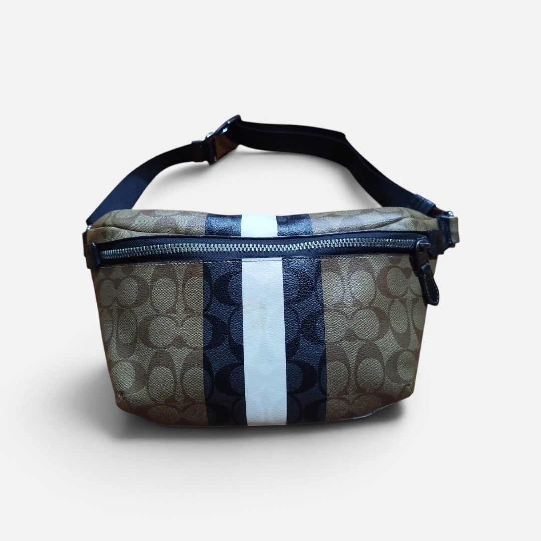 Coach Monogram Waist Bag with Stripes (Category: Luxury Bags & Wallets) located in Quezon. Submitted by ikeanbuy2025 (Listing ID 1463448541, Image 1). Description: - Preloved - Authentic Coach waist bag in classic monogram print. - Features a stylish stripe detail down the front. - Secure zipper closure. - Adjustable strap for a comfortable fit. - Perfect for keeping your essentials easily accessible. - Please note: Minor marks on the white strip