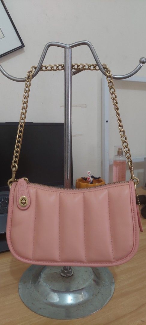 Coach Pink Swinger Bag (Category: Luxury Bags & Wallets) located in Baguio. Submitted by lotus_blossom (Listing ID 1463331710, Image 1). Description: - Pink quilted leather shoulder bag by Coach - Elegant gold chain strap - Secure zipper closure - Interior features convenient card slots - Includes silica gel packet - Small Coach tag attached - Ideal for carrying your daily essentials - bought for personal use but I find it too youthful for me 😆 
