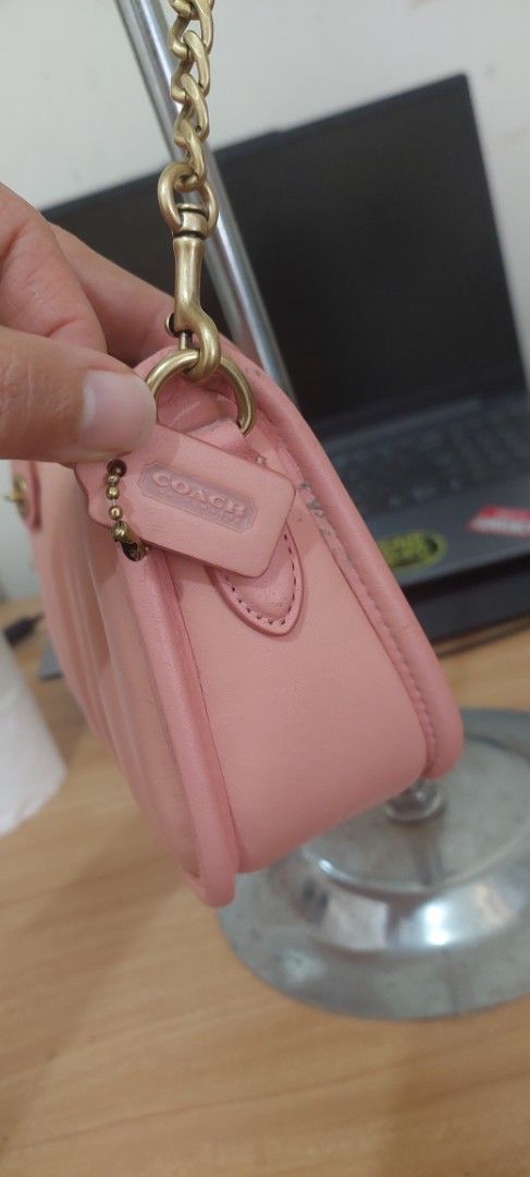 Coach Pink Swinger Bag (Category: Luxury Bags & Wallets) located in Baguio. Submitted by lotus_blossom (Listing ID 1463331710, Image 2). Description: - Pink quilted leather shoulder bag by Coach - Elegant gold chain strap - Secure zipper closure - Interior features convenient card slots - Includes silica gel packet - Small Coach tag attached - Ideal for carrying your daily essentials - bought for personal use but I find it too youthful for me 😆 