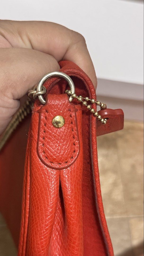 Coach Red Crosstown Crossbody (Category: Luxury Bags & Wallets) located in Pasig City. Submitted by sdpii (Listing ID 1463481628, Image 3). Description: - Authentic Coach red leather shoulder bag - Features a stylish gold turn-lock closure - Comes with a detachable gold chain strap - Includes a longer, detachable leather strap - Beautiful pebbled leather texture - Small Coach logo tag attached - Ideal for evening events or carrying just the essen
