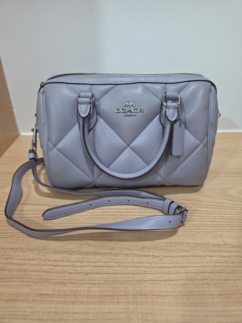 Coach Rowan Satchel (Mist) (Category: Luxury Bags & Wallets) located in Manila. Submitted by flyfreee (Listing ID 1463374143, Image 1). Description: - Authentic Coach Rowan Satchel with Puffy Diamond Quilting - Top handles for carrying - Detachable shoulder strap for versatility - Secure zipper closure - Interior Coach brand tag - Comes with dust bag that has a hole on the side but can be fixed - bought from Coach in Gilroy Premium Outlets in Cal