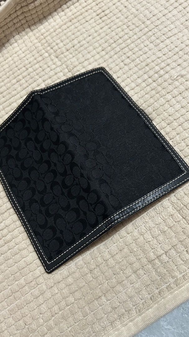Coach Signature C Monogram Bifold Wallet Black (Category: Luxury Bags & Wallets) located in Caloocan City. Submitted by belaciao_ (Listing ID 1463420316, Image 2). Description: - Classic Coach wallet - Black signature C monogram canvas - Leather interior with card slots and bill compartment - Secure snap closure - Dimensions: Approx. 7" x 3.5" (closed) - Ideal for everyday use.