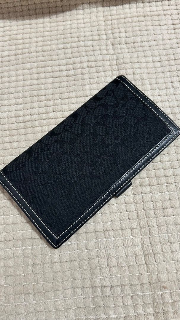 Coach Signature C Monogram Bifold Wallet Black (Category: Luxury Bags & Wallets) located in Caloocan City. Submitted by belaciao_ (Listing ID 1463420316, Image 1). Description: - Classic Coach wallet - Black signature C monogram canvas - Leather interior with card slots and bill compartment - Secure snap closure - Dimensions: Approx. 7" x 3.5" (closed) - Ideal for everyday use.
