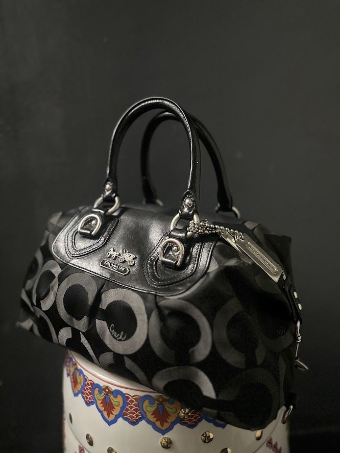 Coach Signature C Monogram Satchel Bag (Category: Luxury Bags & Wallets) located in Caloocan City. Submitted by zealgem_d3432f (Listing ID 1463527967, Image 1). Description: - Authentic black Coach satchel bag - Signature 'C' monogram pattern - Genuine leather handles and trim - Sleek silver hardware accents - Includes original Coach hangtag - Secure zipper closure - Ample interior space for essentials - Ideal for everyday wear *Note: Interior Co