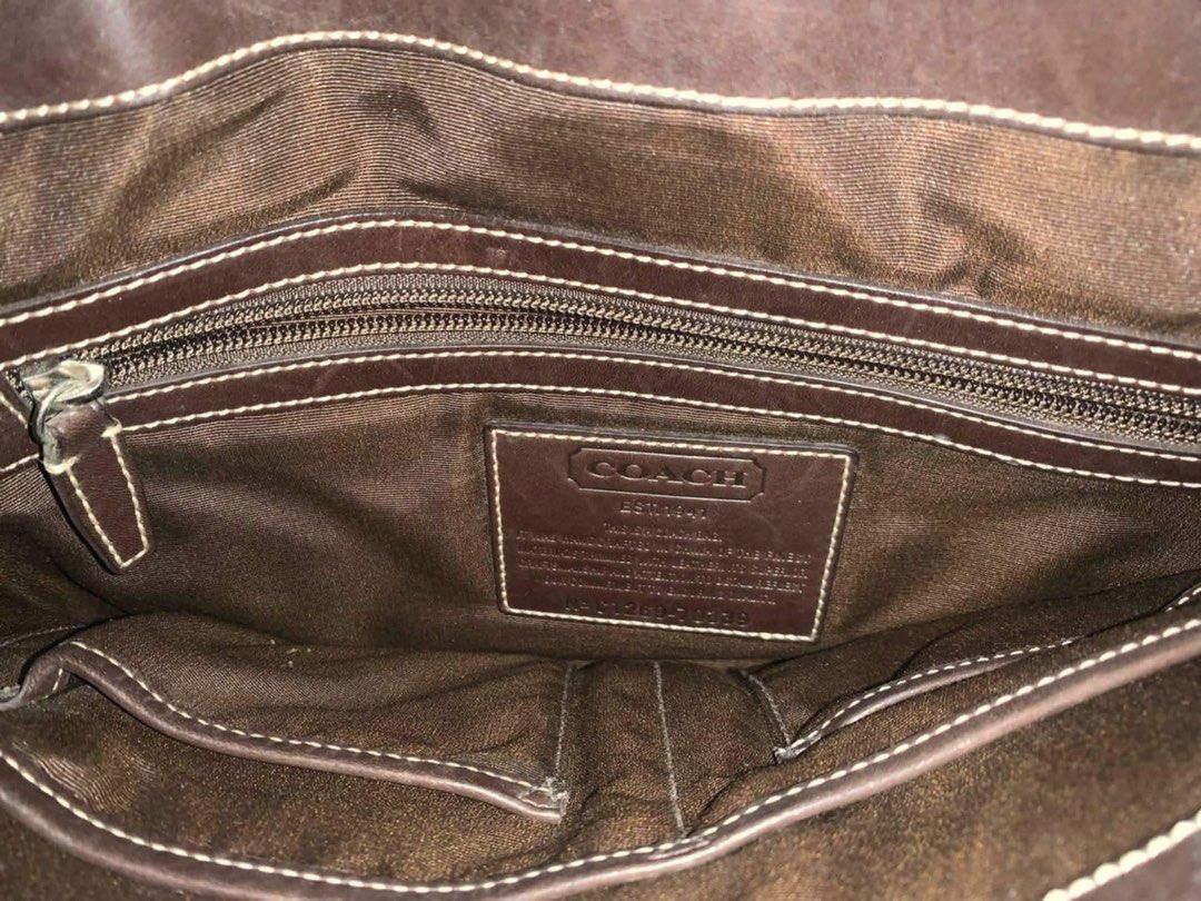 Coach Signature Messenger Bag (Category: Luxury Bags & Wallets) located in Santa Rosa. Submitted by skinticket888 (Listing ID 1463388568, Image 3). Description: Coach Signature Messenger Bag Width: 13 inches (~33 cm) Height: 11.8 inches (~30 cm) Depth: 3 inches (~7.6 cm) Strap Drop: Adjustable webbed crossbody strap extending up to a 53-inch drop, complete with a sliding shoulder pad comfort grip. Capacity: Large enough to accommodate documents, 