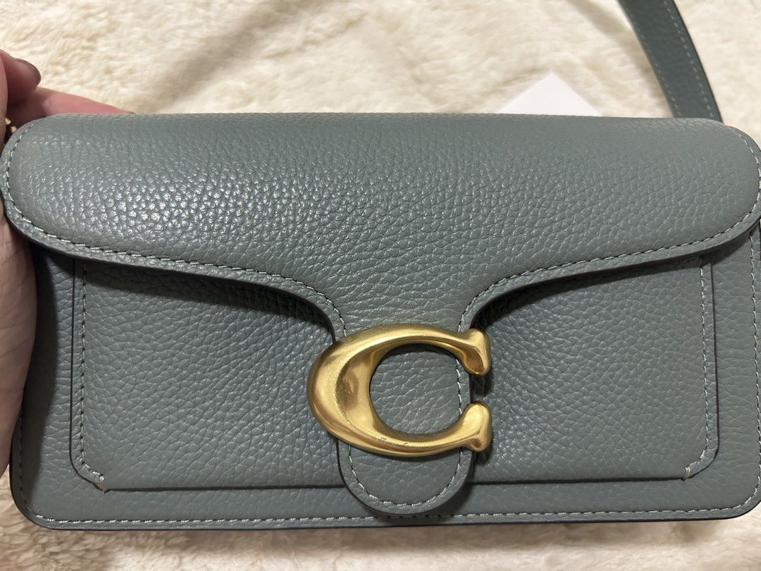 Coach Tabby Bag Genuine Pebbled Leather (Category: Luxury Bags & Wallets) located in Malabon City. Submitted by jenjerenjen13 (Listing ID 1463433097, Image 2). Description: - Authentic Coach Tabby Bag - color sage green - Genuine Pebbled Leather - Iconic Gold C Hardware - preloved - original - size 20 (mini) - with tag , coach dustbag , can provide receipt - with long strap - 9/10 condition.