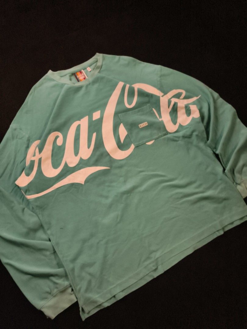 Coca Cola x KITH (Category: Coats, Jackets and Outerwear) located in San Fernando. Submitted by gaboo_asncn (Listing ID 1463547960, Image 1). Description: - Coca Cola x KITH - Size: XL on tag (W26/L32) - Condition: Excellent - Color Rate: 9/10 - No issue / "need wash".
