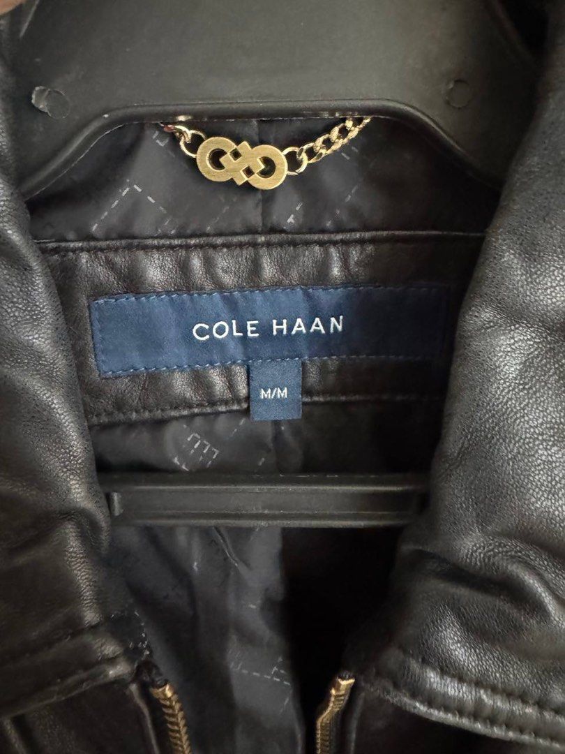 Cole Haan Black Quilted Leather Jacket M/M (Category: Coats, Jackets and Outerwear) located in Taguig. Submitted by anxmz (Listing ID 1463465463, Image 2). Description: - Brand: Cole Haan - Color: Black - Material: Leather - Size: M - Design: Quilted detailing on shoulders and sleeves - Accents: Gold zipper details - Versatile: Great for layering or wearing on its own.