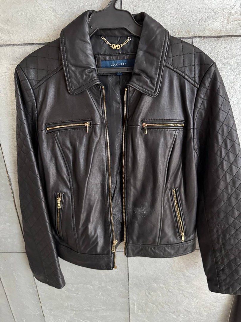 Cole Haan Black Quilted Leather Jacket M/M (Category: Coats, Jackets and Outerwear) located in Taguig. Submitted by anxmz (Listing ID 1463465463, Image 1). Description: - Brand: Cole Haan - Color: Black - Material: Leather - Size: M - Design: Quilted detailing on shoulders and sleeves - Accents: Gold zipper details - Versatile: Great for layering or wearing on its own.