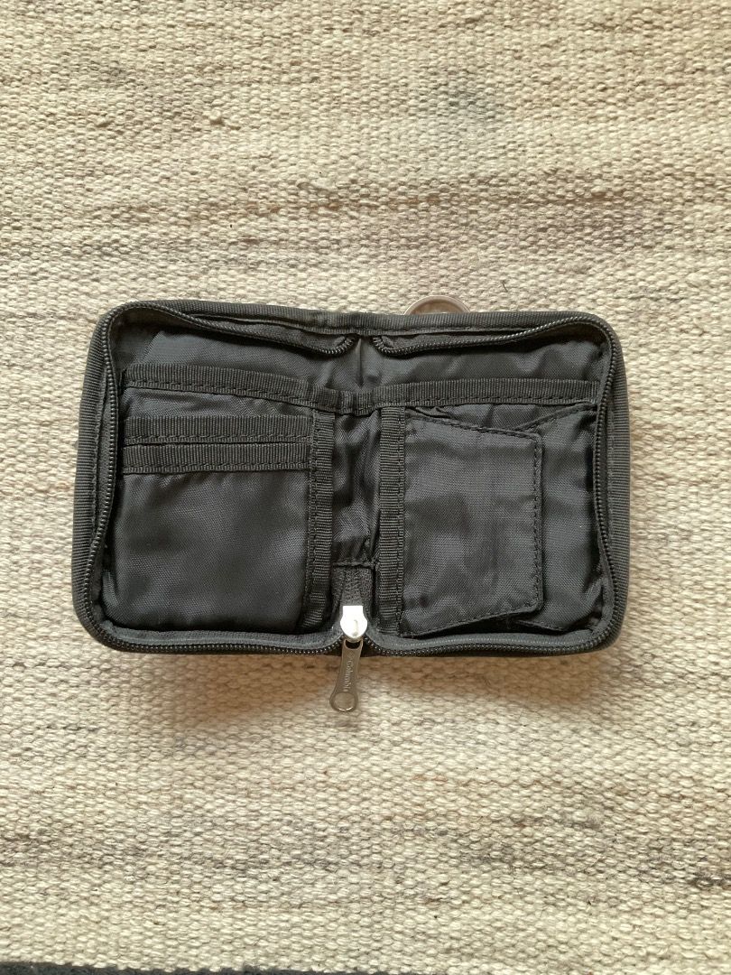 Columbia Wallet (Category: Wallets & Card holders) located in Mandaluyong City. Submitted by philbert420 (Listing ID 1463425196, Image 3). Description: - Tan Columbia wallet - Zippered closure for security - Multiple interior compartments for cards and cash - Convenient keyring attachment on the outside - Compact size, perfect for travel or everyday use.