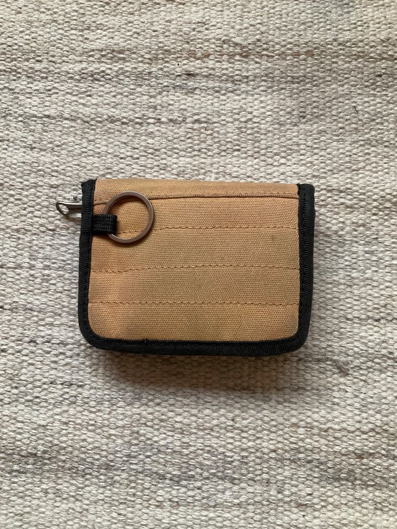 Columbia Wallet (Category: Wallets & Card holders) located in Mandaluyong City. Submitted by philbert420 (Listing ID 1463425196, Image 2). Description: - Tan Columbia wallet - Zippered closure for security - Multiple interior compartments for cards and cash - Convenient keyring attachment on the outside - Compact size, perfect for travel or everyday use.