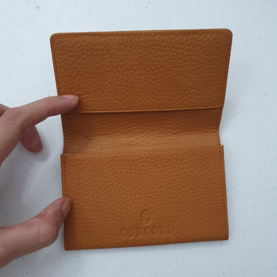 Concord Leather Card Holder Wallet Tan (Category: Wallets & Card holders) located in Paranaque City. Submitted by cobien (Listing ID 1463449522, Image 3). Description: - Genuine tan leather card holder - Textured pebble grain finish - Multiple interior slots for cards - Embossed Concord logo inside - Slim and pocket-friendly design - Ideal for keeping your essential cards organized.