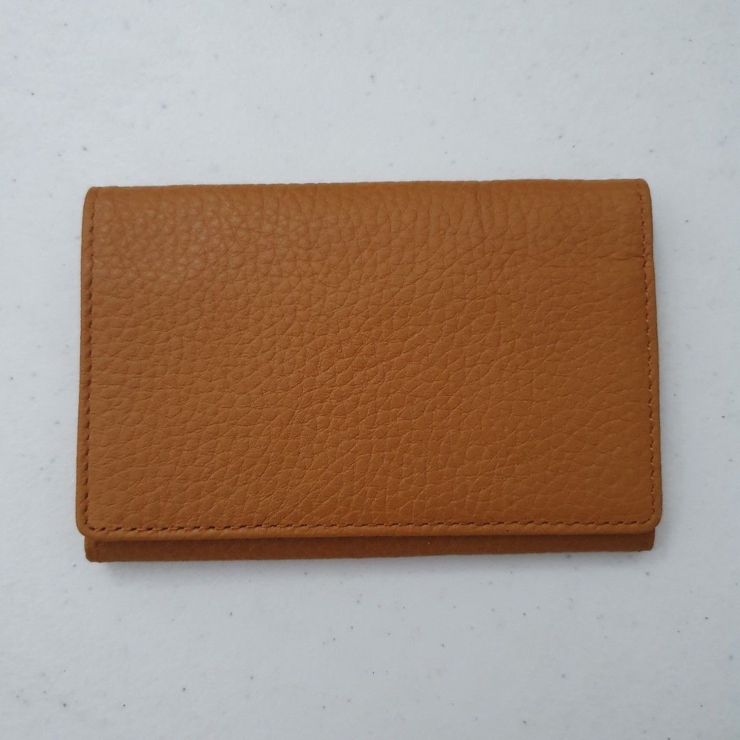 Concord Leather Card Holder Wallet Tan (Category: Wallets & Card holders) located in Paranaque City. Submitted by cobien (Listing ID 1463449522, Image 1). Description: - Genuine tan leather card holder - Textured pebble grain finish - Multiple interior slots for cards - Embossed Concord logo inside - Slim and pocket-friendly design - Ideal for keeping your essential cards organized.