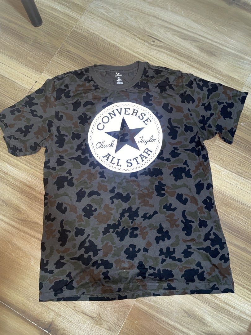 Converse All Star Camo T-Shirt (Category: Tshirts & Polo Shirts ) located in Manila. Submitted by clementdav22513 (Listing ID 1463440952, Image 1). Description: - Classic Converse t-shirt - Features a cool camouflage pattern - Iconic Chuck Taylor All Star logo on the front - Made in Vietnam - Ideal for casual wear and everyday style.