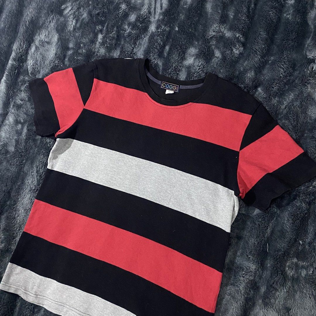 COOGI Striped T-Shirt (Category: Tshirts & Polo Shirts ) located in Zamboanga. Submitted by yusufmanue57647 (Listing ID 1463365901, Image 2). Description: - Cool COOGI tee - Features horizontal stripes in black, red, and grey - Made from 100% cotton - Ideal for casual wear - Fits S/C - Refer to label for care instructions - L .