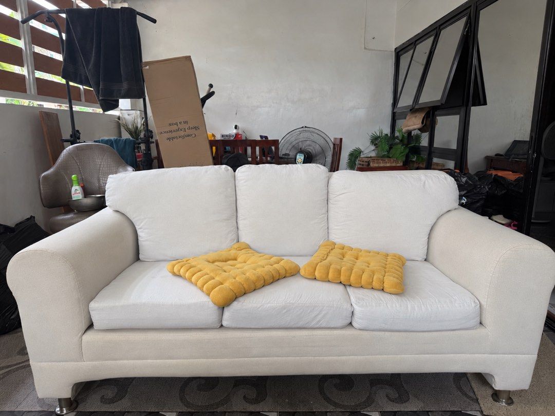 Cream 3-Seater Sofa with White Cushions (Category: Sofas) located in Manila. Submitted by pipaymoyi237548 (Listing ID 1463418289, Image 2). Description: Rush kaka pull lang from condo 8,000 ( need cleaning medyo madumi ung arm rest ) No issue. Heavy duty comfy- Comfortable 3-seater sofa - Cream-colored base and arms - White, removable seat and back cushions - Modern design with sleek legs - Ideal for living rooms or lounges - Ready for a new home