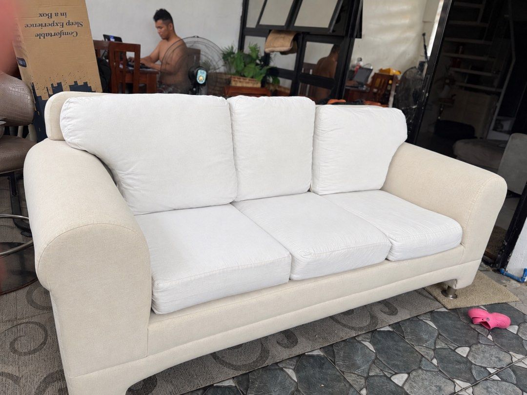Cream 3-Seater Sofa with White Cushions (Category: Sofas) located in Manila. Submitted by pipaymoyi237548 (Listing ID 1463418289, Image 1). Description: Rush kaka pull lang from condo 8,000 ( need cleaning medyo madumi ung arm rest ) No issue. Heavy duty comfy- Comfortable 3-seater sofa - Cream-colored base and arms - White, removable seat and back cushions - Modern design with sleek legs - Ideal for living rooms or lounges - Ready for a new home