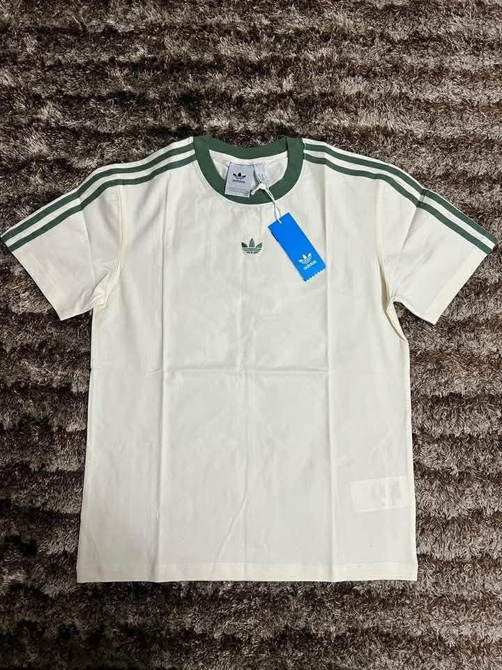Cream Adidas Original T shirt (Category: Tshirts & Polo Shirts ) located in Manila. Submitted by actd_luxury (Listing ID 1463539959, Image 1). Description: xl:21x28.