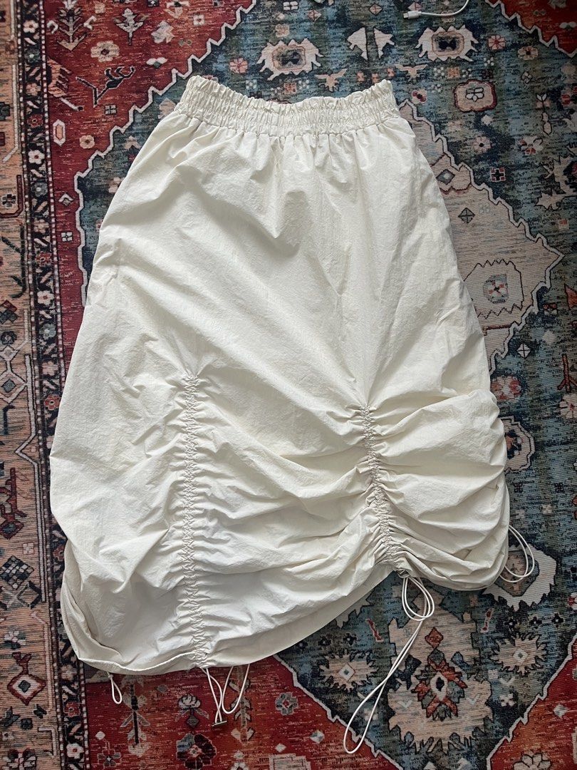 Cream Ruched Drawstring Midi Skirt (Category: Skirts) located in Quezon City. Submitted by lynchburg (Listing ID 1463354969, Image 3). Description: - Cream midi skirt - Ruched drawstring detail at hem for adjustable silhouette - Comfortable elastic waistband - Lightweight material - Ideal for casual wear.