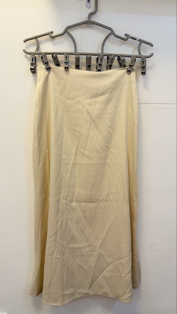 Cream Satin Midi Skirt (Category: Skirts) located in Angeles City. Submitted by hooni_park (Listing ID 1463480735, Image 2). Description: - Waist line 23-25 - Cream satin midi skirt - Back zipper closure - Beautiful fabric sheen - Slip skirt silhouette - Versatile for dressing up or down.