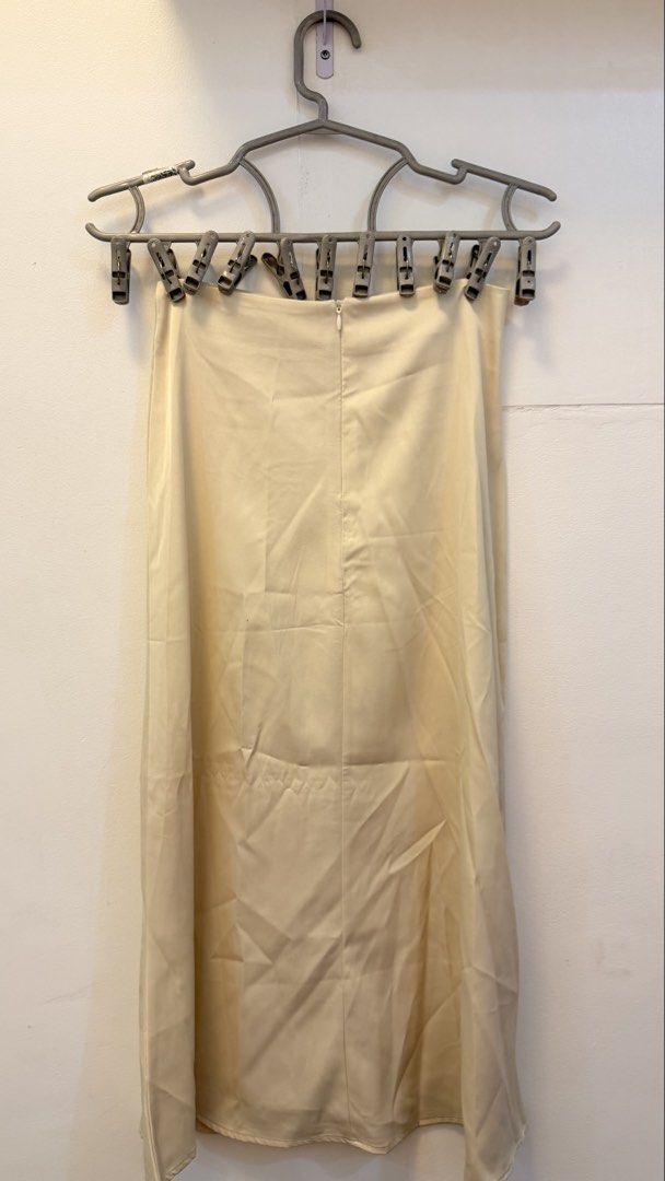 Cream Satin Midi Skirt (Category: Skirts) located in Angeles City. Submitted by hooni_park (Listing ID 1463480735, Image 3). Description: - Waist line 23-25 - Cream satin midi skirt - Back zipper closure - Beautiful fabric sheen - Slip skirt silhouette - Versatile for dressing up or down.