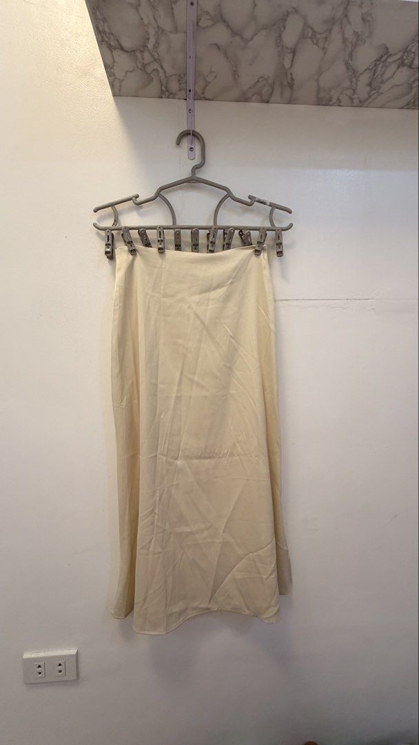 Cream Satin Midi Skirt (Category: Skirts) located in Angeles City. Submitted by hooni_park (Listing ID 1463480735, Image 1). Description: - Waist line 23-25 - Cream satin midi skirt - Back zipper closure - Beautiful fabric sheen - Slip skirt silhouette - Versatile for dressing up or down.