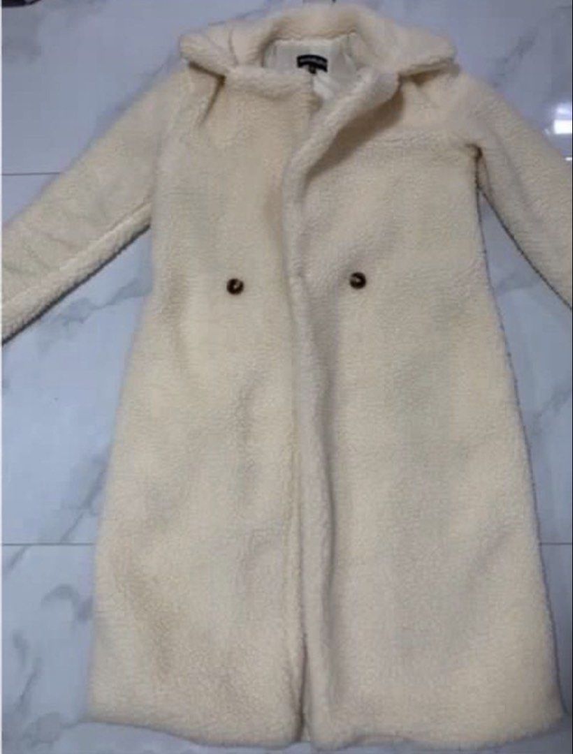 Cream Teddy Coat Double Breasted (Category: Coats, Jackets and Outerwear) located in Manila. Submitted by decluterthings888 (Listing ID 1463547964, Image 2). Description: - Cream colored teddy coat - Double-breasted style with two buttons - Mid-length - Super cozy and warm - Great for cooler weather - Easy to style with anything.
