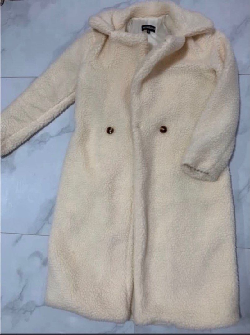 Cream Teddy Coat Double Breasted (Category: Coats, Jackets and Outerwear) located in Manila. Submitted by decluterthings888 (Listing ID 1463547964, Image 1). Description: - Cream colored teddy coat - Double-breasted style with two buttons - Mid-length - Super cozy and warm - Great for cooler weather - Easy to style with anything.