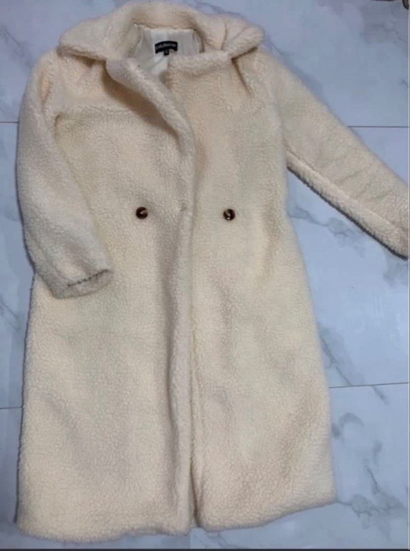 Cream Teddy Coat with Double Breasted Buttons (Category: Coats, Jackets and Outerwear) located in Manila. Submitted by decluterthings888 (Listing ID 1463548005, Image 2). Description: - Super cozy cream teddy coat - Long length, ideal for colder days - Classic collar - Double-breasted button closure - Looks incredibly soft and warm - Great for layering over any outfit.