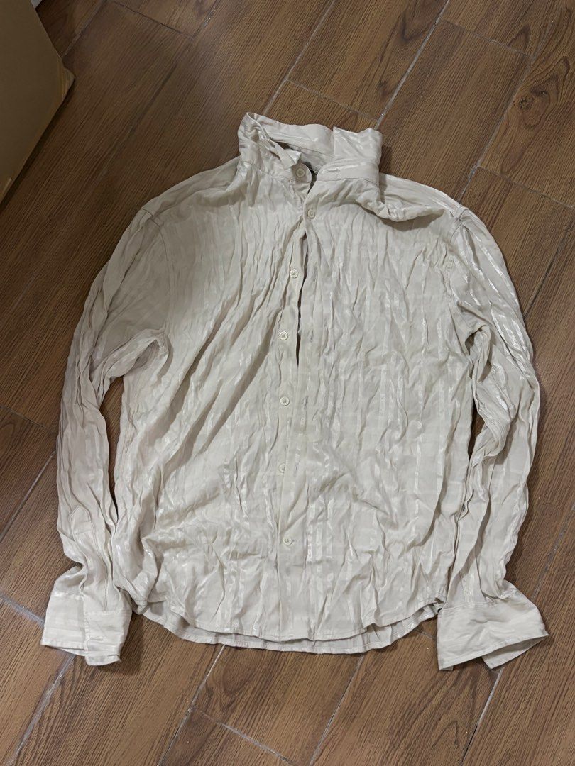 Cream Textured Long Sleeve Button Up Shirt (Category: Tshirts & Polo Shirts ) located in Manila. Submitted by rich028 (Listing ID 1463521410, Image 1). Description: - Cream colored long sleeve shirt - Unique textured fabric with vertical stripes - Button up front with a collared neckline - Perfect for dressing up or down.