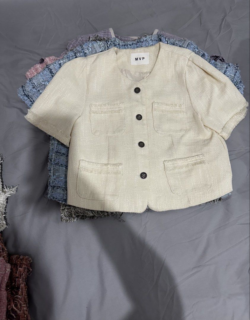 Cream Tweed Cropped Top with Buttons (Category: Coats, Jackets and Outerwear) located in Manila. Submitted by everythingsale101 (Listing ID 1463437570, Image 3). Description: - Cream cropped jacket from MVP - Textured tweed fabric with frayed edges - Four front pockets - Four dark buttons down the front - Short sleeves - Round neckline - Versatile for layering over tops or dresses - Creates a chic, put-together look Fits M-L (up to 38 bust) —Prem