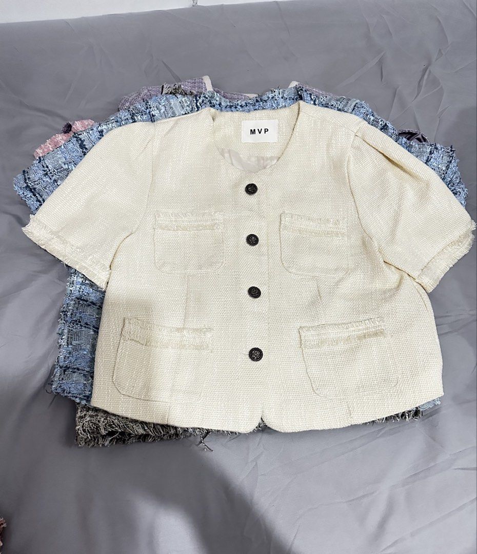 Cream Tweed Cropped Top with Buttons (Category: Coats, Jackets and Outerwear) located in Manila. Submitted by everythingsale101 (Listing ID 1463437570, Image 1). Description: - Cream cropped jacket from MVP - Textured tweed fabric with frayed edges - Four front pockets - Four dark buttons down the front - Short sleeves - Round neckline - Versatile for layering over tops or dresses - Creates a chic, put-together look Fits M-L (up to 38 bust) —Prem