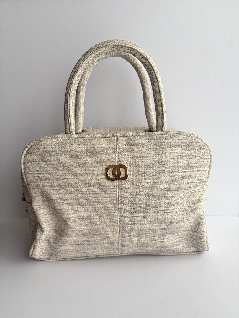 Cream/Gray Handbag (Category: Purses & Pouches) located in Quezon City. Submitted by wagwagan_ukay_blues (Listing ID 1463377723, Image 1). Description: From Japan In good condition L-9” W-4” H-7” Made in vietnam.