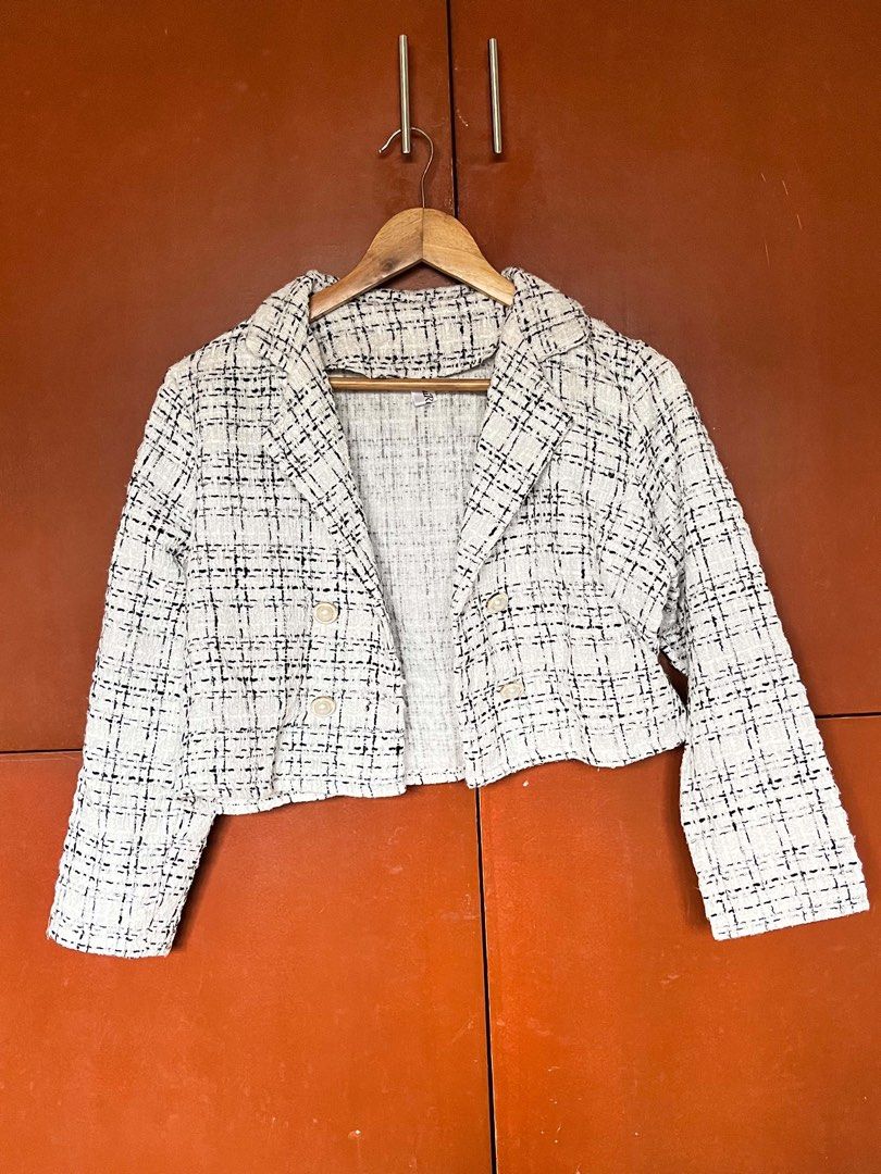 Cropped Tweed Jacket with Black and White Pattern (Category: Coats, Jackets and Outerwear) located in Malolos. Submitted by vanderwoodsen_ (Listing ID 1463424979, Image 1). Description: - Cute cropped jacket - Classic black and white tweed pattern - Two front buttons - Versatile for layering over tops or dresses - Creates a chic, put-together look.