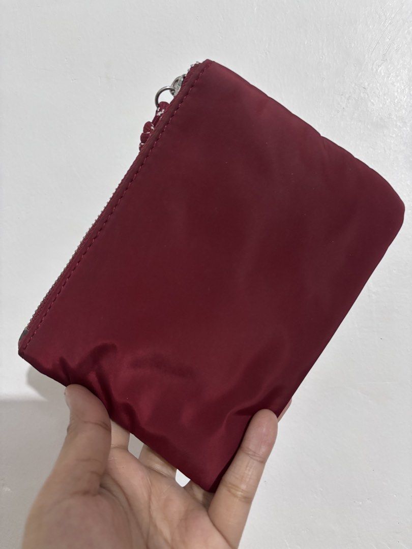Cute Lips Pouch with Double Zippers (Category: Purses & Pouches) located in Manila. Submitted by fashionfinds21 (Listing ID 1463353032, Image 2). Description: - Small pouch with a fun lip print on one side. - Plain maroon on the other side. - Features two zippers for easy access. - Includes a cute rope pull on one zipper. - Perfect for organizing small essentials. - Shows some signs of wear on the edges of the zippers. .