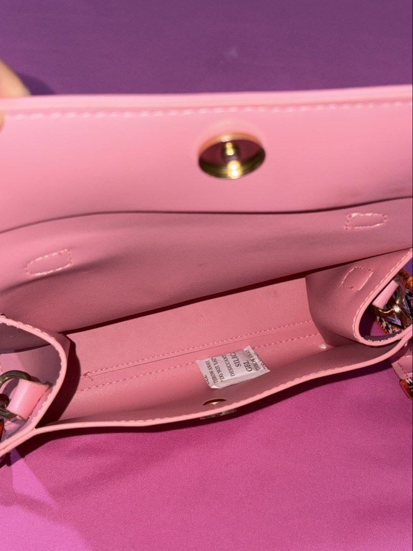 Cute Pink Handbag with Colorful Strap (Category: Shoulder Bags) located in Quezon City. Submitted by luna_ily (Listing ID 1463513079, Image 3). Description: 🍒 Be reminded that this is preloved and may not be in its best condition as before. It has very minimal stains but the zipper and the strap are still working properly. 🍒 Don’t hesitate to send a message for further details and inquiries. .