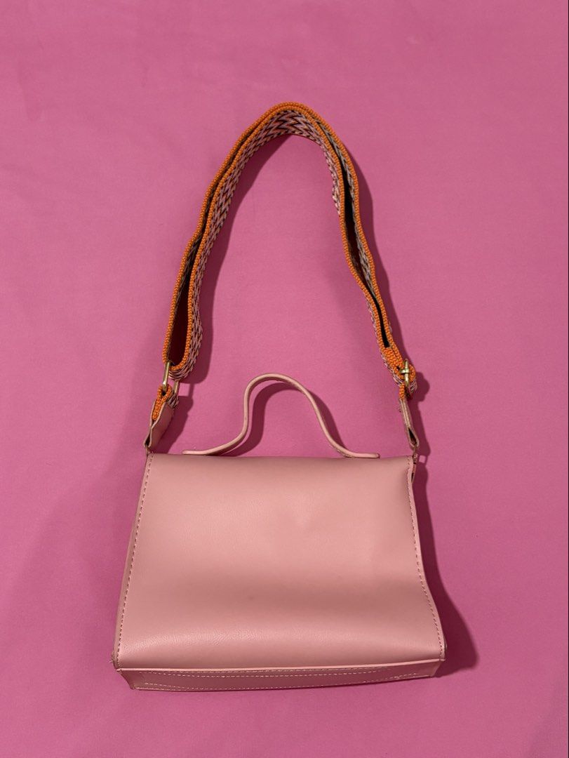 Cute Pink Handbag with Colorful Strap (Category: Shoulder Bags) located in Quezon City. Submitted by luna_ily (Listing ID 1463513079, Image 2). Description: 🍒 Be reminded that this is preloved and may not be in its best condition as before. It has very minimal stains but the zipper and the strap are still working properly. 🍒 Don’t hesitate to send a message for further details and inquiries. .