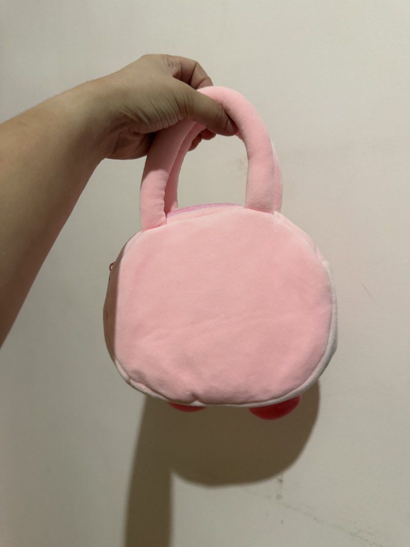 Cute Pink Kirby Plush Handbag (Category: Handmade Craft) located in Taytay. Submitted by cloudy_20 (Listing ID 1463478020, Image 2). Description: - Adorable pink plush handbag shaped like Kirby. - Secure zipper closure to keep your belongings safe. - Soft and comfortable handles for easy carrying. - Ideal for small essentials like your phone, wallet, or keys. - A must-have accessory for any Kirby enthusiast!.