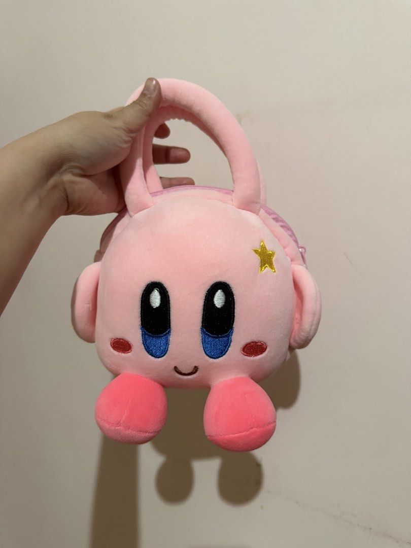 Cute Pink Kirby Plush Handbag (Category: Handmade Craft) located in Taytay. Submitted by cloudy_20 (Listing ID 1463478020, Image 1). Description: - Adorable pink plush handbag shaped like Kirby. - Secure zipper closure to keep your belongings safe. - Soft and comfortable handles for easy carrying. - Ideal for small essentials like your phone, wallet, or keys. - A must-have accessory for any Kirby enthusiast!.