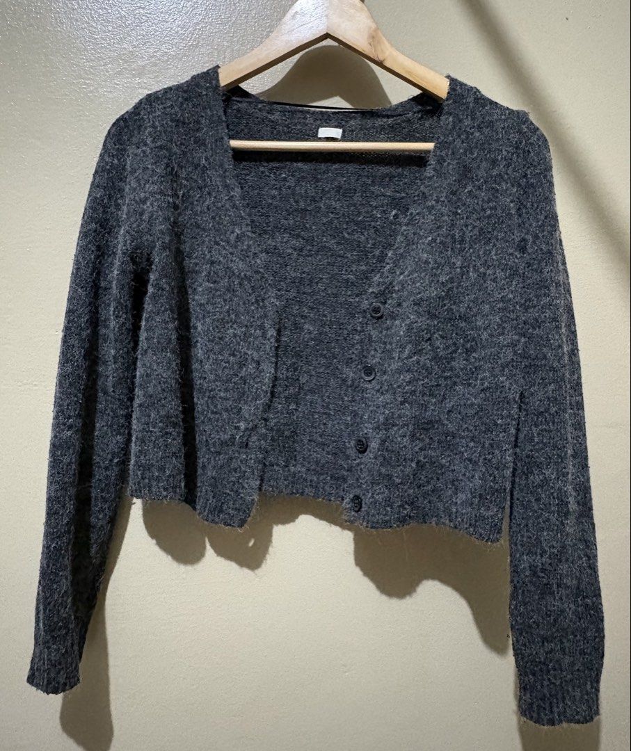 Dark Grey Cropped Cardigan (Category: Coats, Jackets and Outerwear) located in Manila. Submitted by stella_mari27 (Listing ID 1463437105, Image 1). Description: - Dark grey cropped cardigan - Fuzzy knit material - V-neck with button closure - Long sleeves - Estimated size: Small to Medium - Ideal for layering over tops or dresses - Versatile addition to your wardrobe.