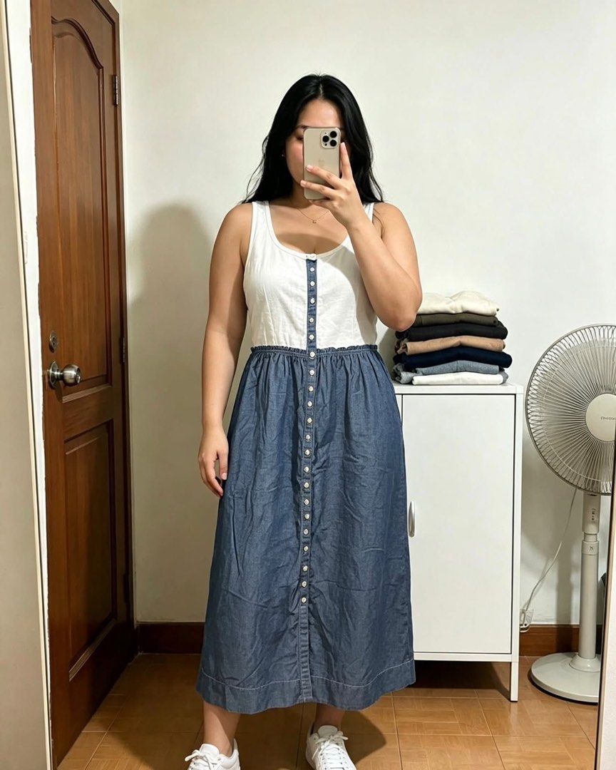 Denim Button-Front Midi Dress (Category: Dresses) located in Manila. Submitted by despacito17 (Listing ID 1463343116, Image 1). Description: - White top paired with a blue denim midi skirt - Skirt features a full button-front closure - Comfortable elasticated waistband - Midi length for a stylish silhouette - Effortlessly transitions from casual daywear to beach-ready chic.