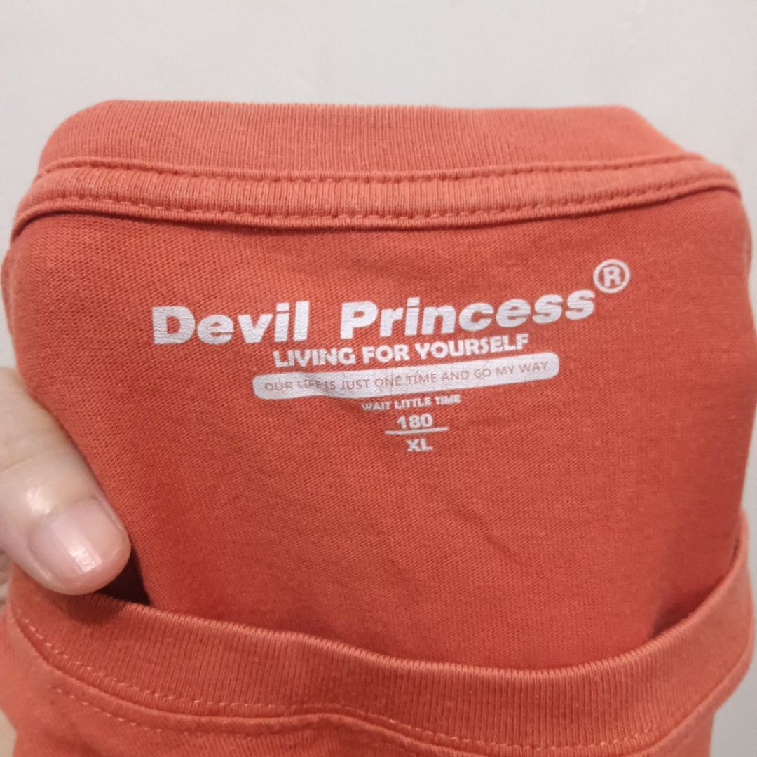 DEVIL PRINCESS Graphic Shirt (Category: Shirts) located in Caloocan City. Submitted by jaychingsss (Listing ID 1463486391, Image 3). Description: Devil Princess Graphic Shirt - 50 22x37 Complete Tags Color Rate: 9/10 NEED WASH.