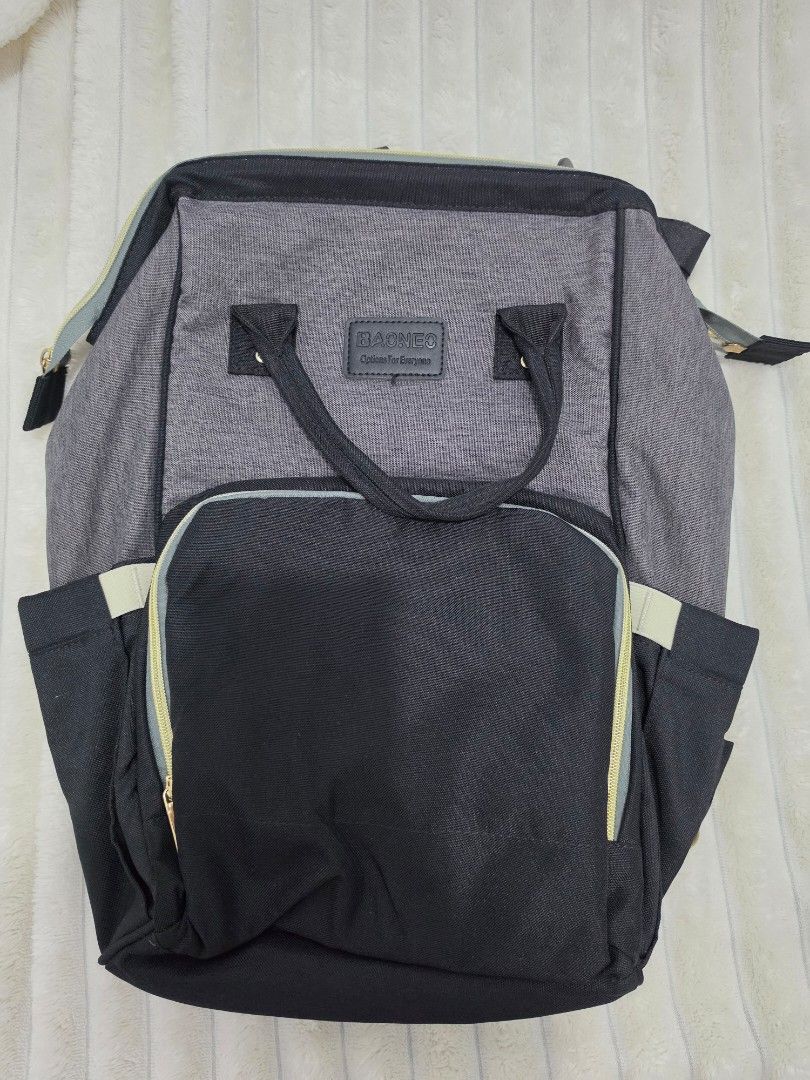 DIAPER CHANGING BAG/ BABY BAG (Category: Diaper Bags & Wetbags) located in Manila. Submitted by shieladmd (Listing ID 1463428280, Image 3). Description: - Stylish grey and black backpack - Multiple compartments for organized storage - Front pocket with zippers and internal organizers - Spacious main compartment with additional pockets - Adjustable straps for a comfortable fit - Ideal for travel adventures or everyday commutes.