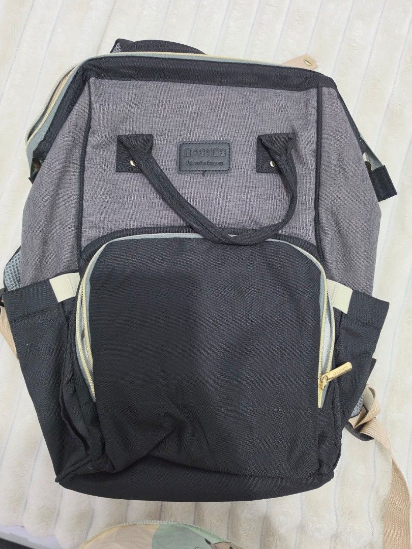 DIAPER CHANGING BAG/ BABY BAG (Category: Diaper Bags & Wetbags) located in Manila. Submitted by shieladmd (Listing ID 1463428280, Image 1). Description: - Stylish grey and black backpack - Multiple compartments for organized storage - Front pocket with zippers and internal organizers - Spacious main compartment with additional pockets - Adjustable straps for a comfortable fit - Ideal for travel adventures or everyday commutes.