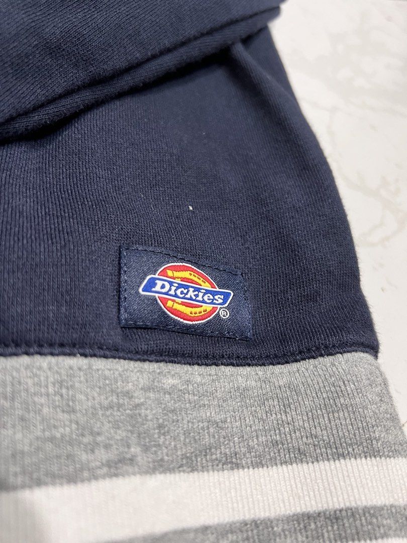 Dickies USA Navy Blue Sweatshirt (Category: Coats, Jackets and Outerwear) located in Talisay. Submitted by maxiesgarments (Listing ID 1463495304, Image 3). Description: - Navy blue sweatshirt with 'Dickies USA' graphic - Grey collar for a classic look - Striped cuffs and hem add a sporty touch - Small Dickies logo tag on the side - Perfect for comfortable, casual wear.