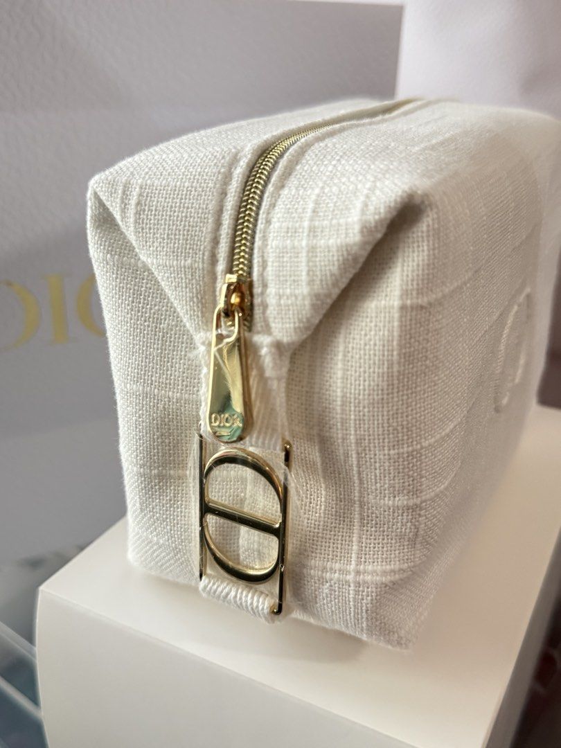 Dior Cosmetic Bag White Pouch (Category: Luxury Bags & Wallets) located in Manila. Submitted by hellomrys (Listing ID 1462842937, Image 2). Description: With box and paper bag.