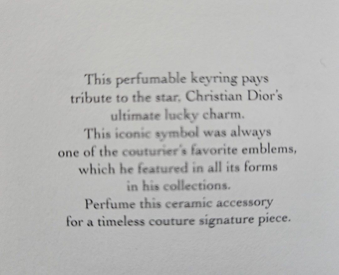 Dior perfumable keychain (Category: Other Accessories) located in Los Banos. Submitted by acleancloset (Listing ID 1463335343, Image 3). Description: pls see photos approx 2 inch ceramic star, total 4 inches including keyring.